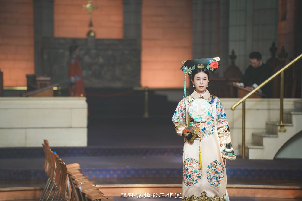 Group of elegant models showcasing beautiful Qipao dresses at a cathedral fashion event, by an Auckland photographer.