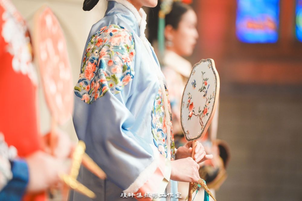 Group of elegant models showcasing beautiful Qipao dresses at a cathedral fashion event, by an Auckland photographer.