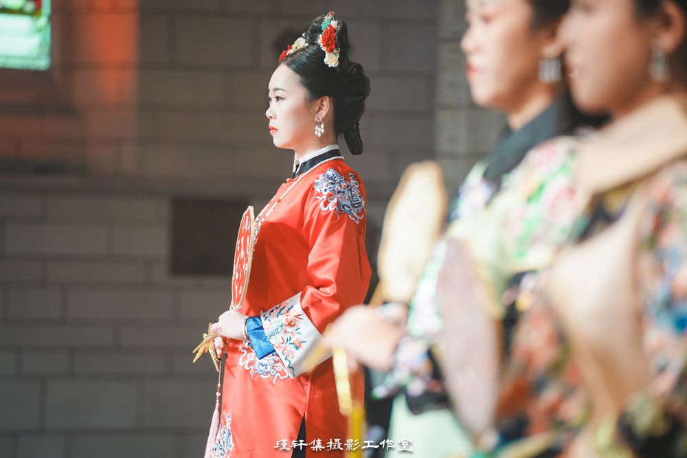 Group of elegant models showcasing beautiful Qipao dresses at a cathedral fashion event, by an Auckland photographer.