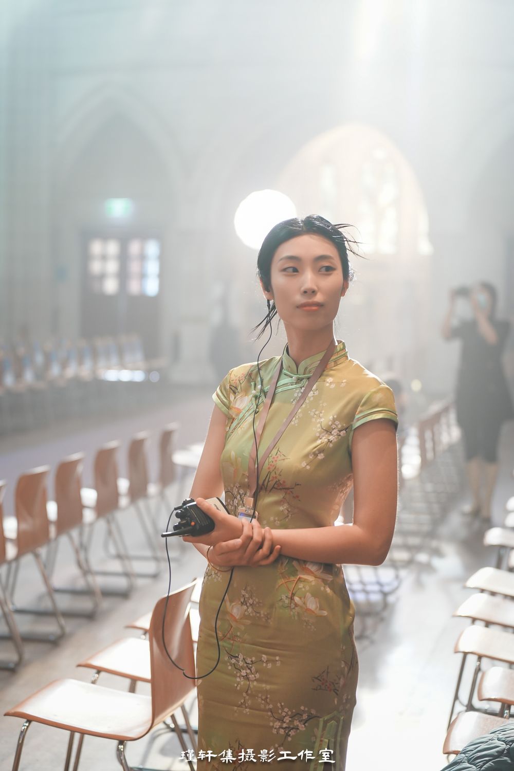 Group of elegant models showcasing beautiful Qipao dresses at a cathedral fashion event, by an Auckland photographer.