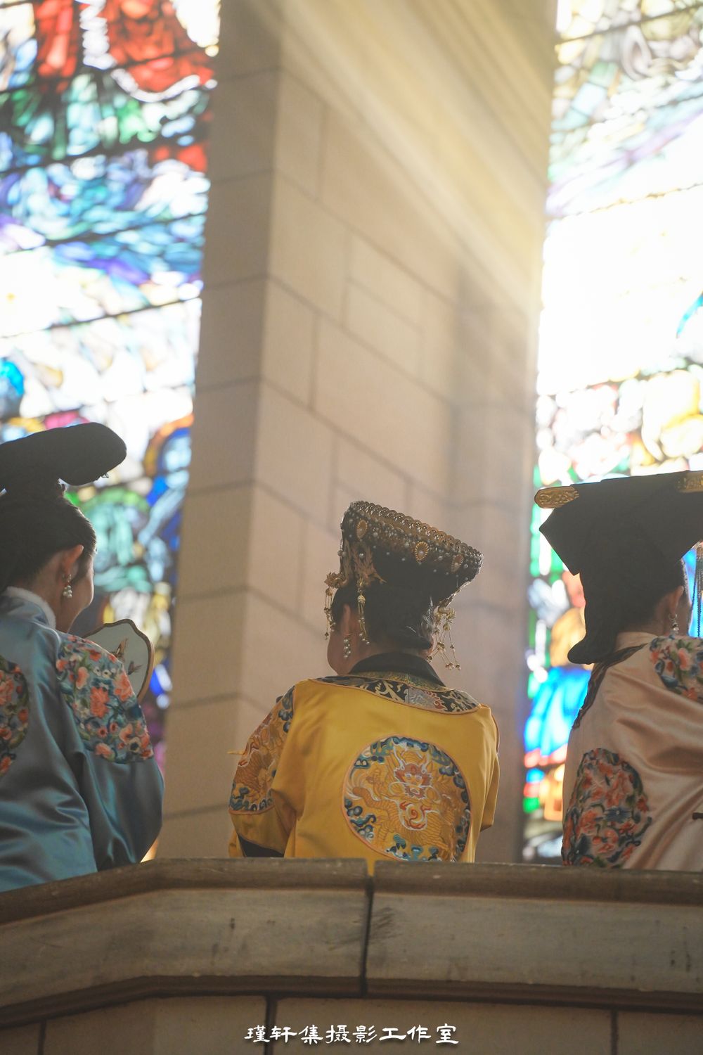 Group of elegant models showcasing beautiful Qipao dresses at a cathedral fashion event, by an Auckland photographer.