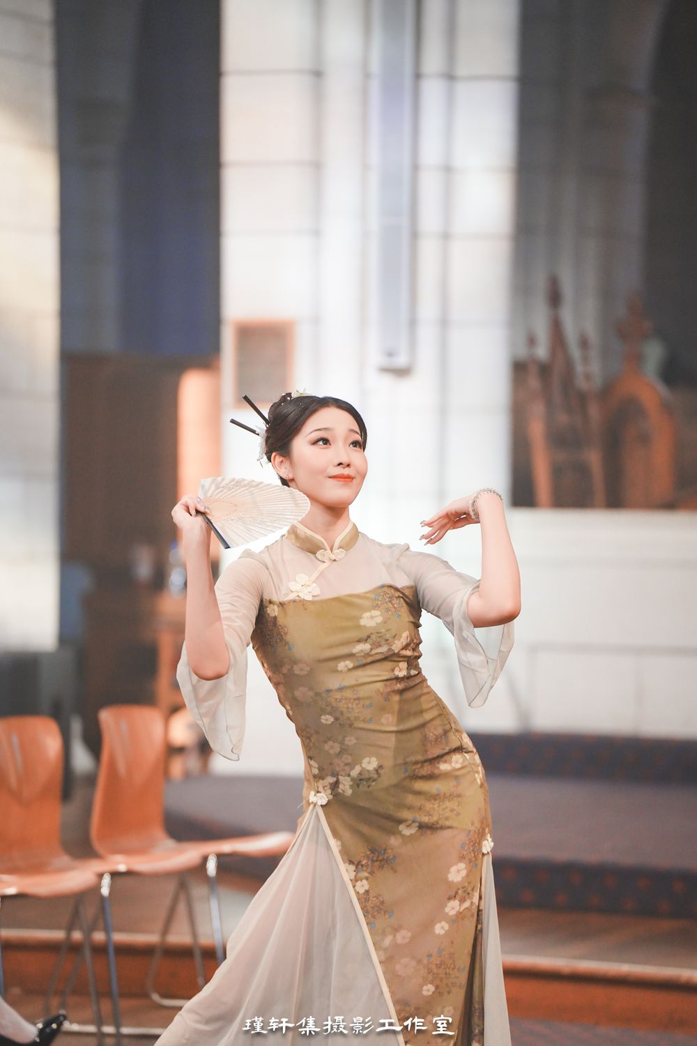 Group of elegant models showcasing beautiful Qipao dresses at a cathedral fashion event, by an Auckland photographer.