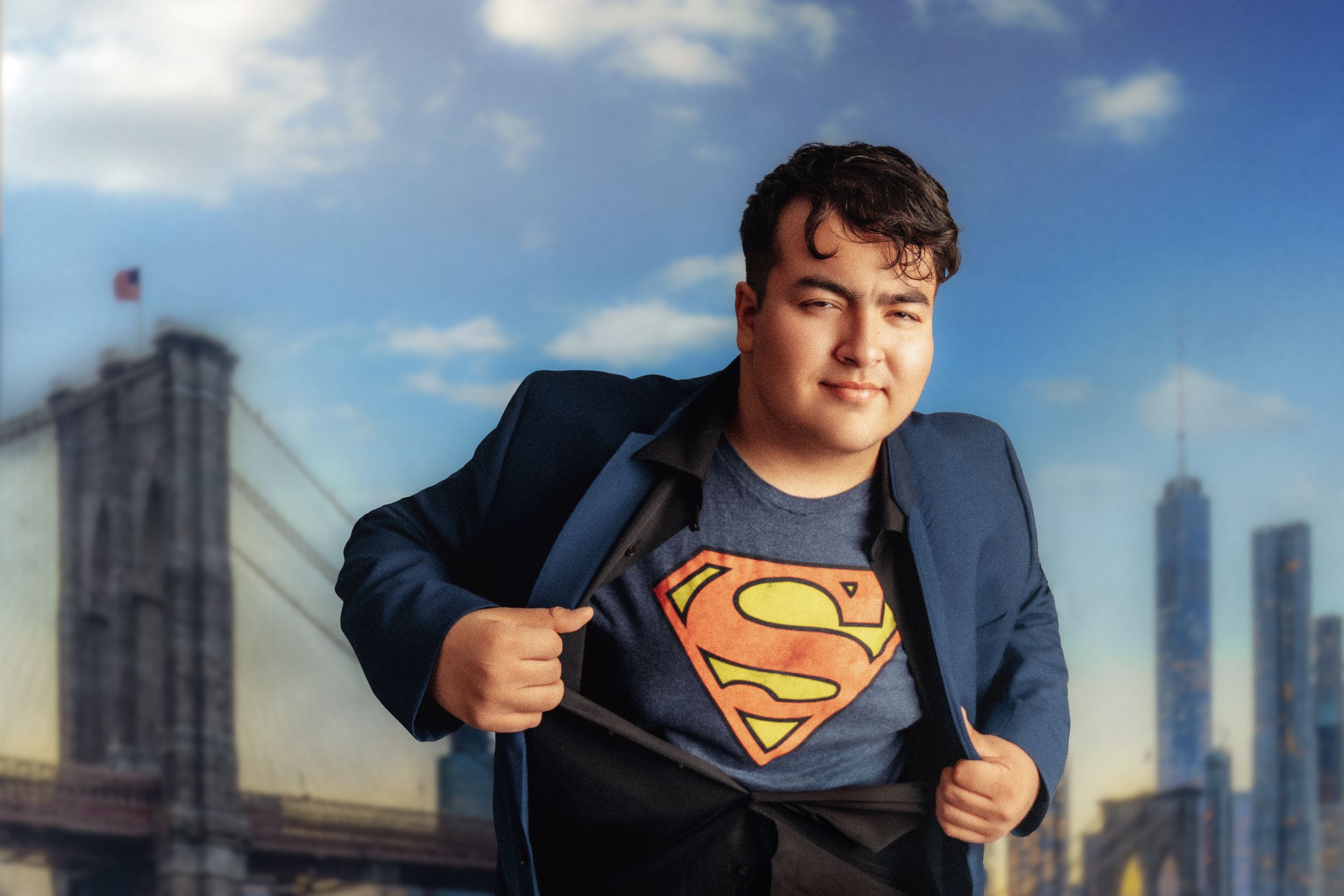 A figure reveals a Superman logo under a business suit with the Brooklyn Bridge and city skyline in the background.