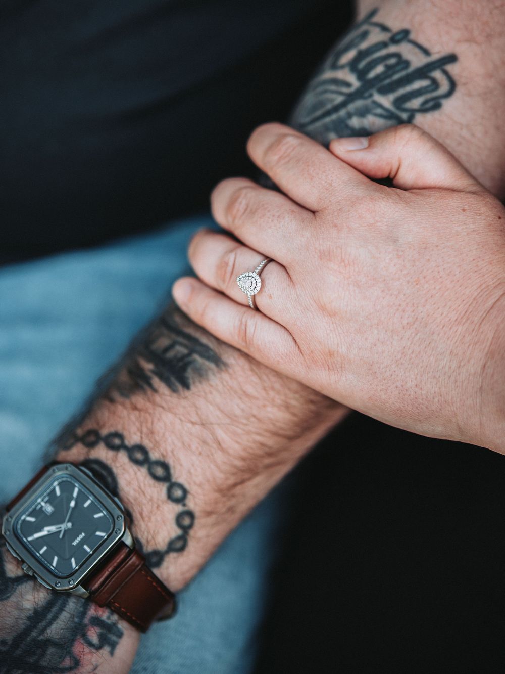 Close-up shots of a wristwatch with leather strap and visible tattoos on the wearer's arm.