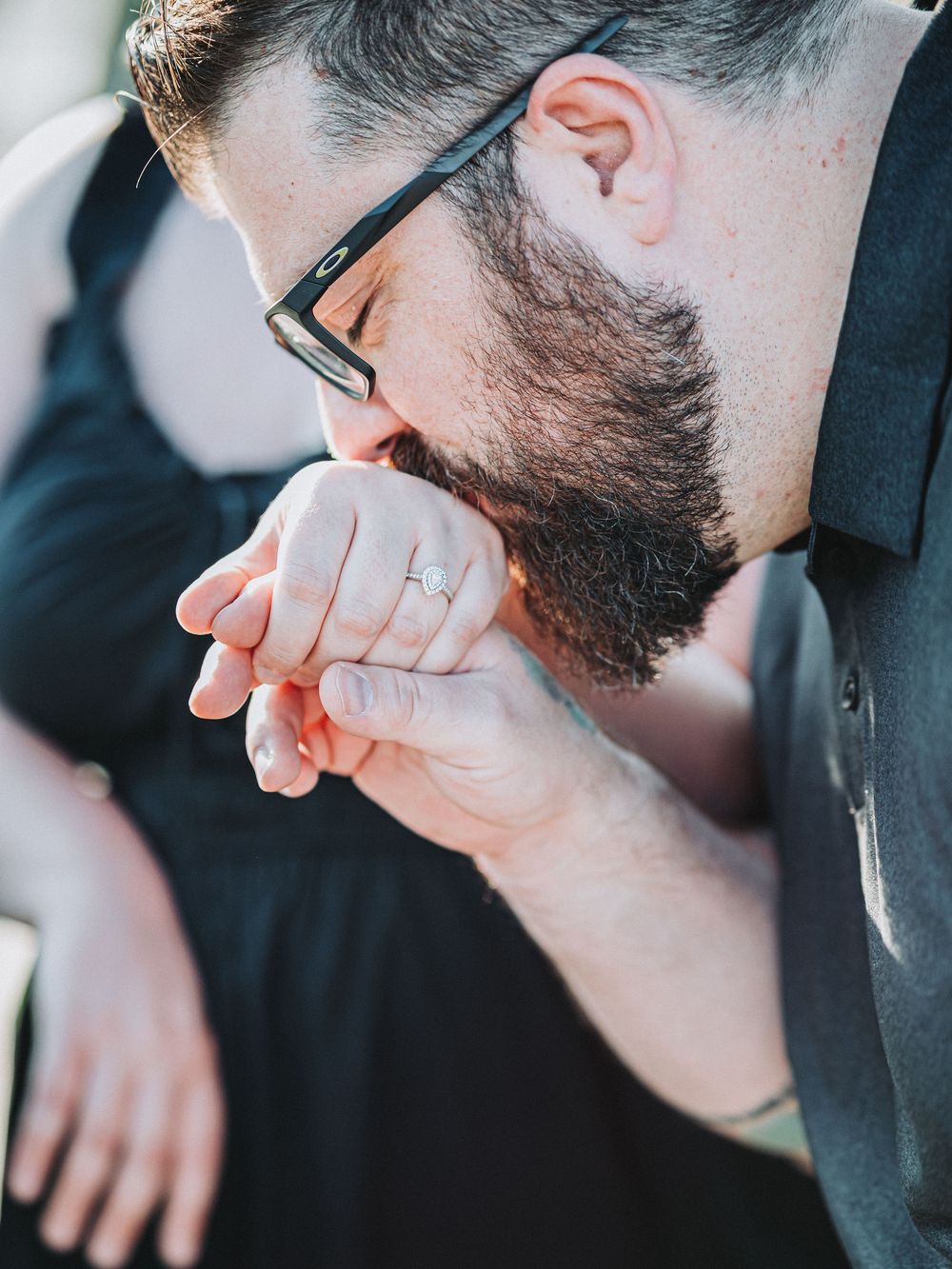 Close-up profile view of someone wearing glasses in natural light.