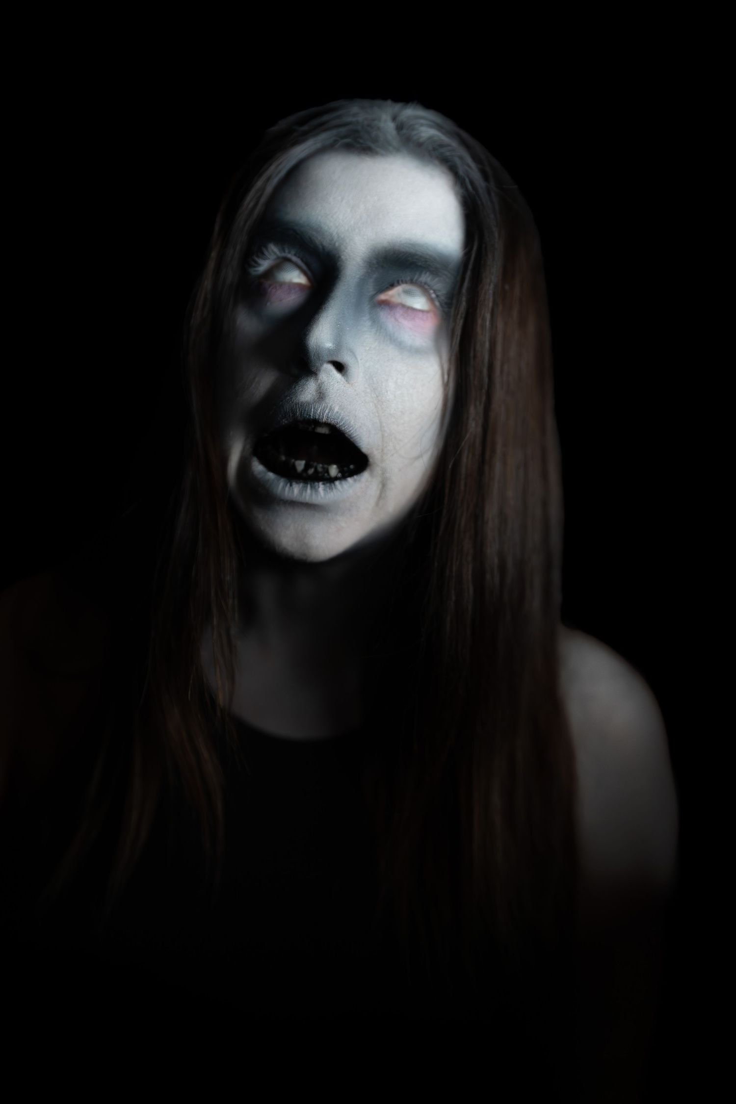 Creepy ghost with black liquid coming out of its mouth.