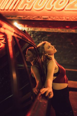 Series of motion shots captured under warm orange lighting showing dynamic poses.