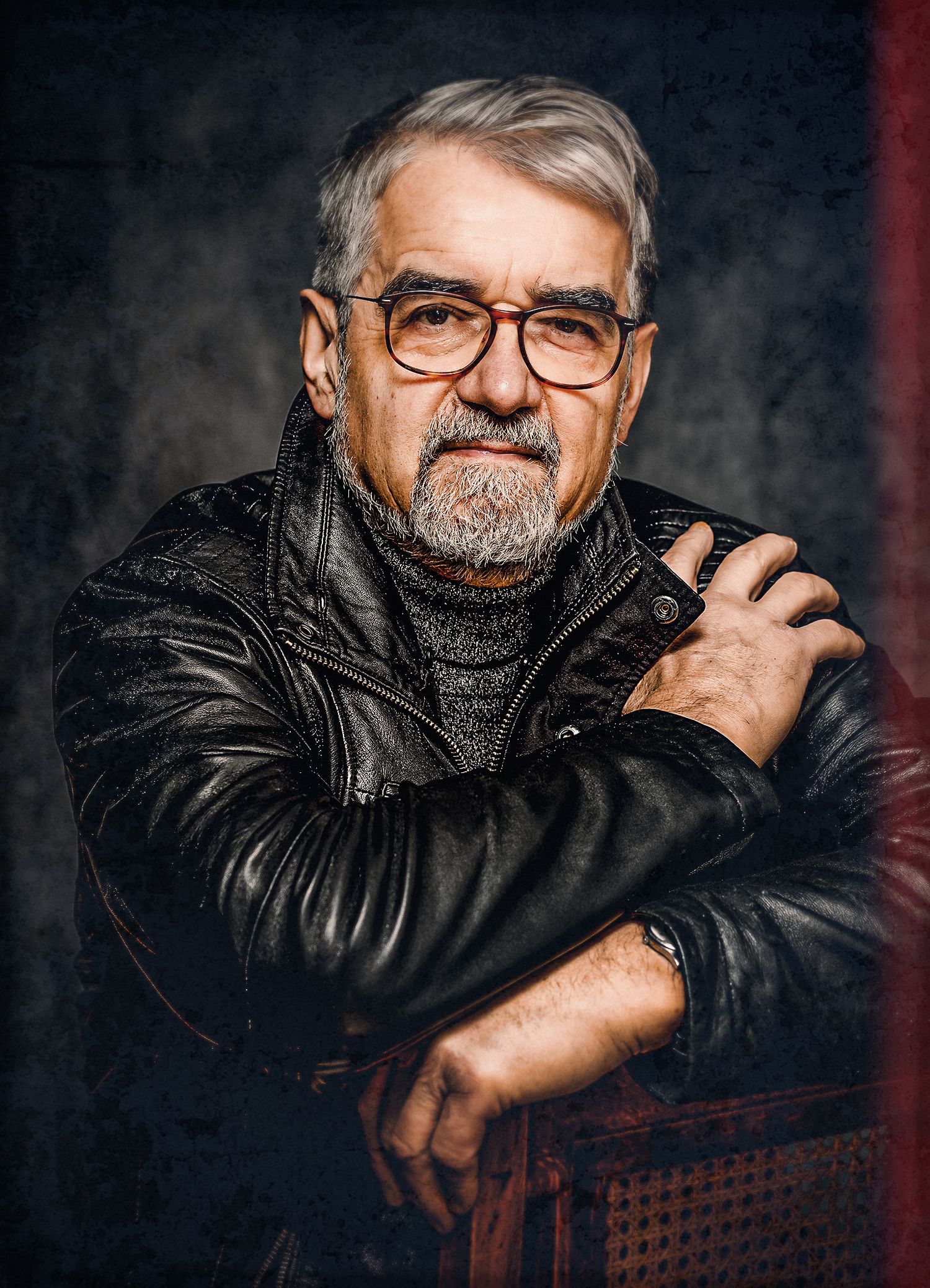 Portrait series of a person in a leather jacket and glasses against dark background showing different contemplative poses.