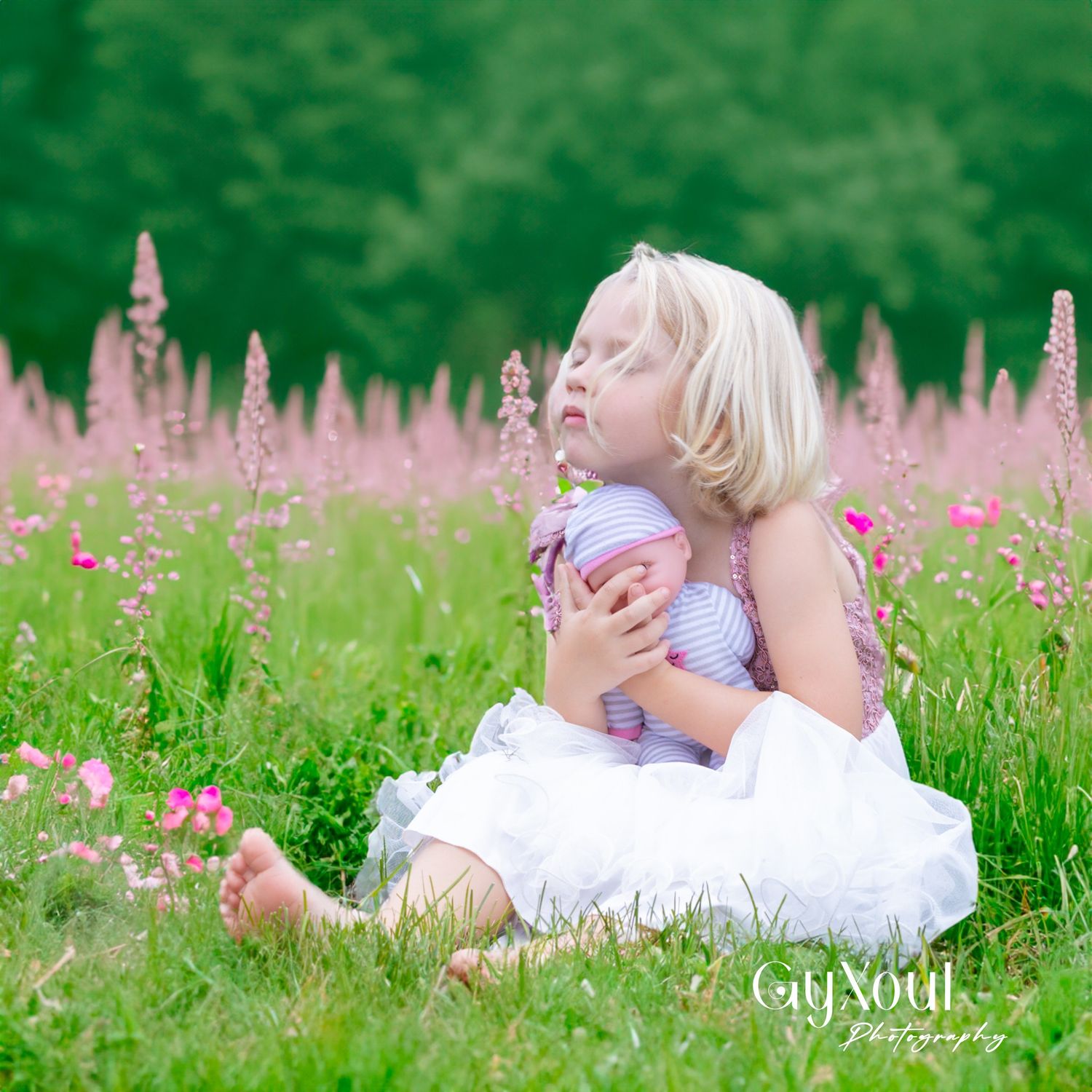 A peaceful moment in a field of purple flowers with soft natural lighting.