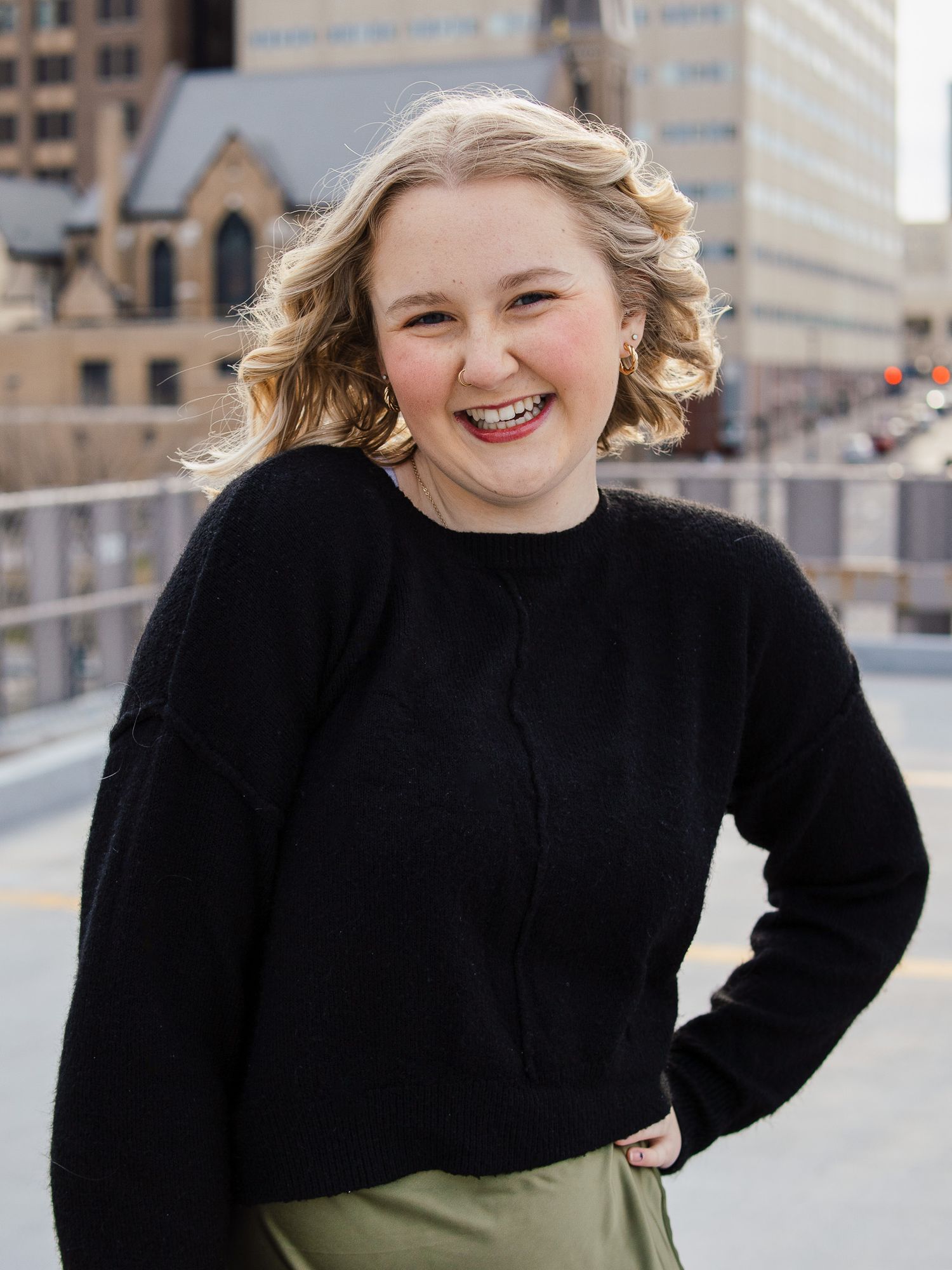headshot of girl on a parking garage rooftop