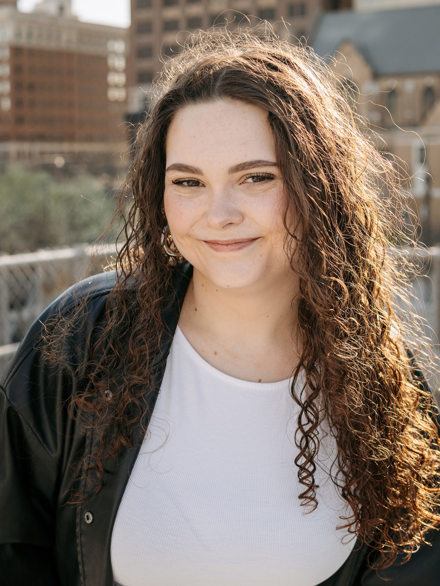 headshot on a parking garage rooftop