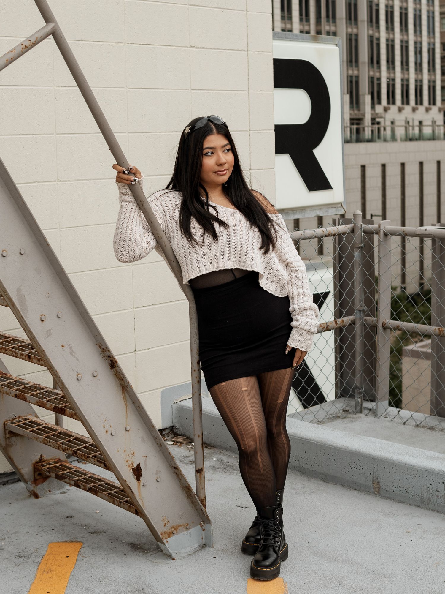 photo of girl on a parking garage rooftop