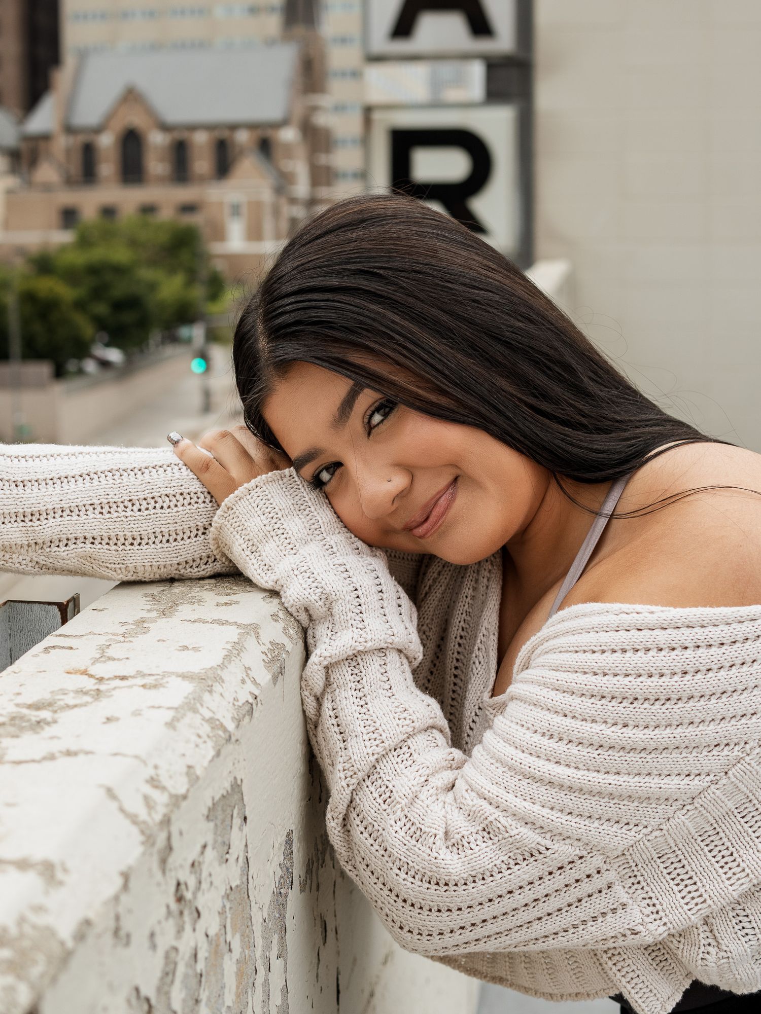headshot of girl on a parking garage rooftop