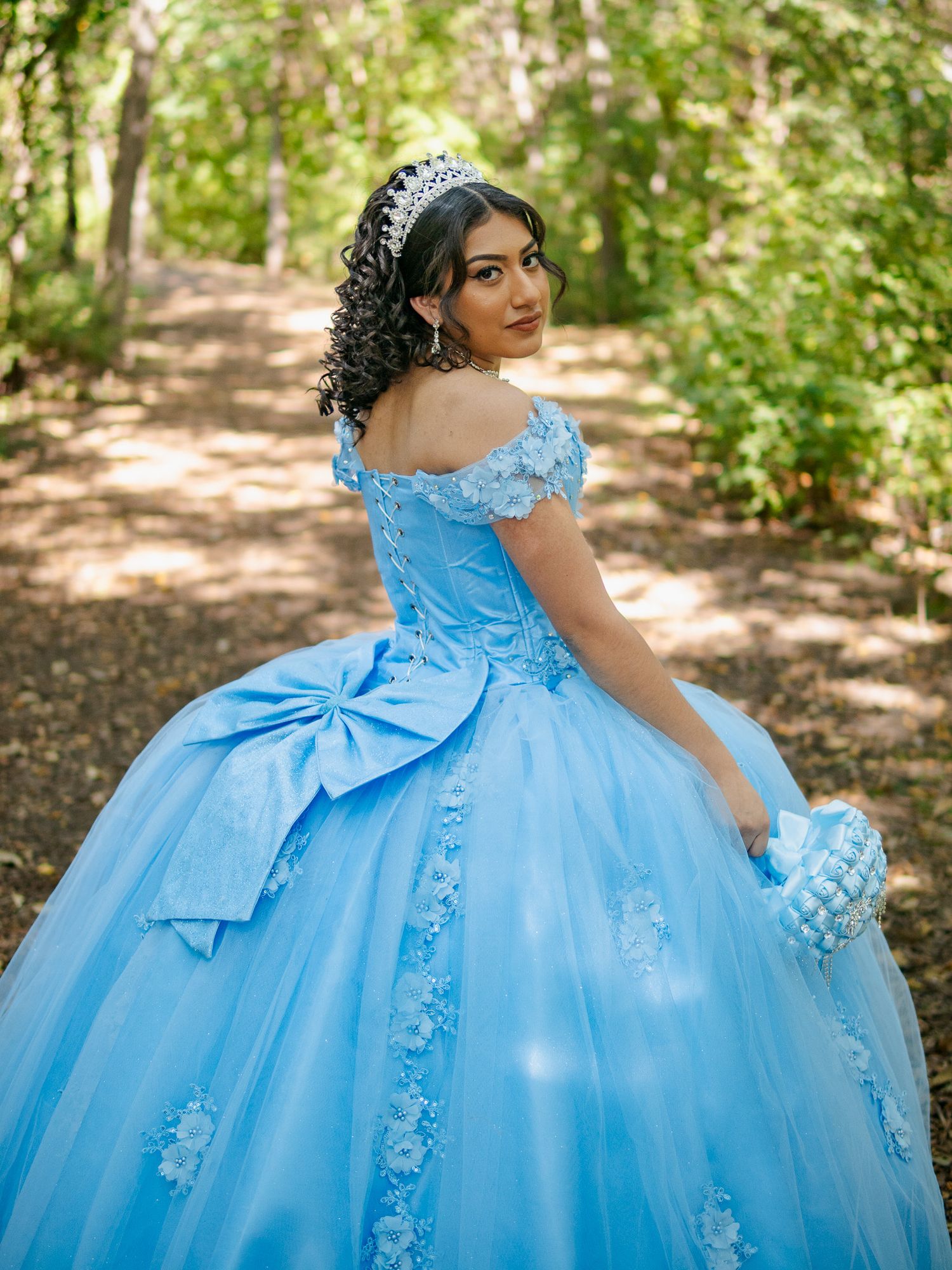 quinceañera photo of girl in a park in nature