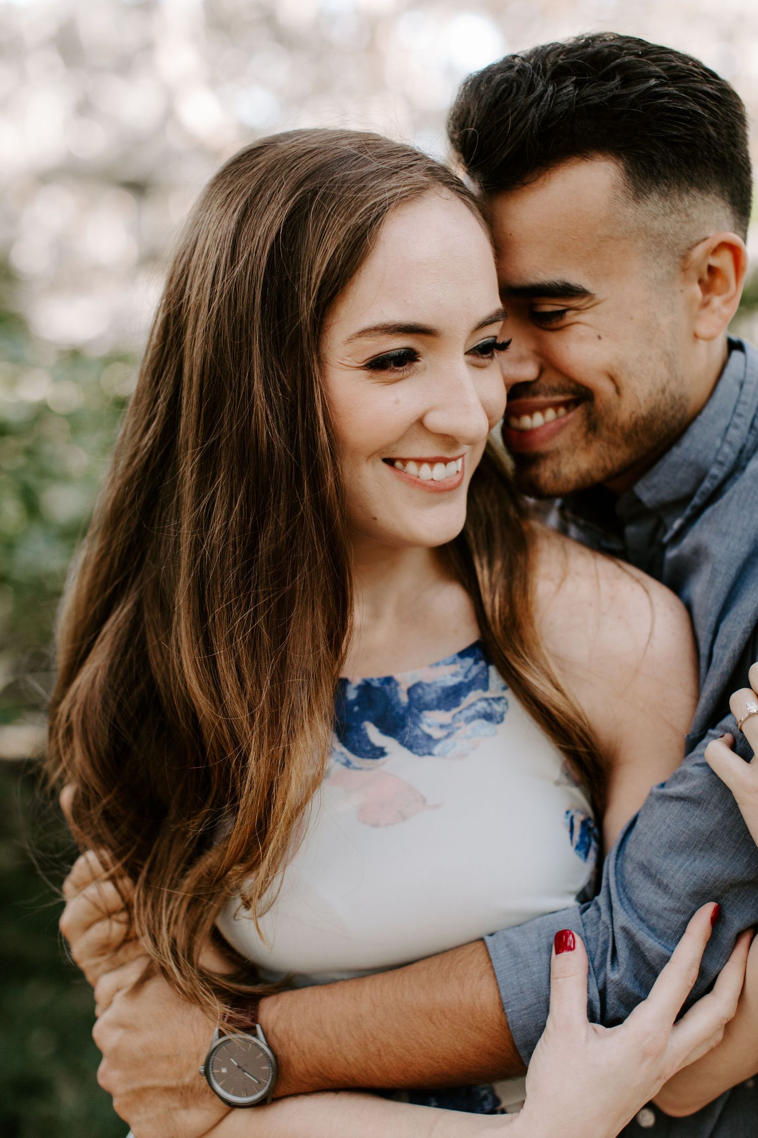 Series of intimate photos showing a couple embracing in casual attire against a muted background.