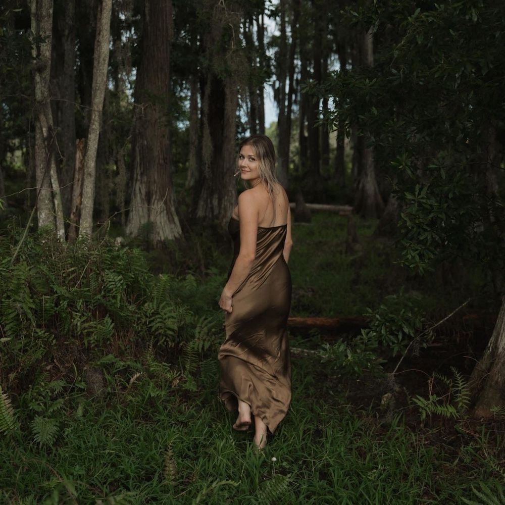 A series of artistic forest photographs showing a figure in a brown dress moving through a mystical woodland setting.