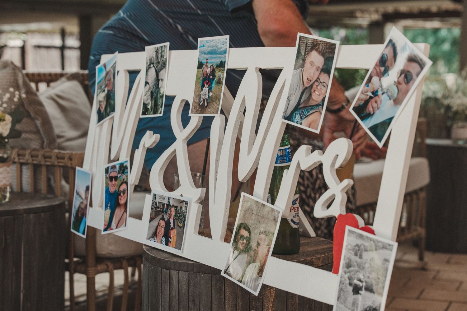 Display of wedding photos arranged in a line showing various moments from the celebration.