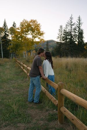 fall couples session on Cedar Mountain in Utah with yellow and orange leaves
