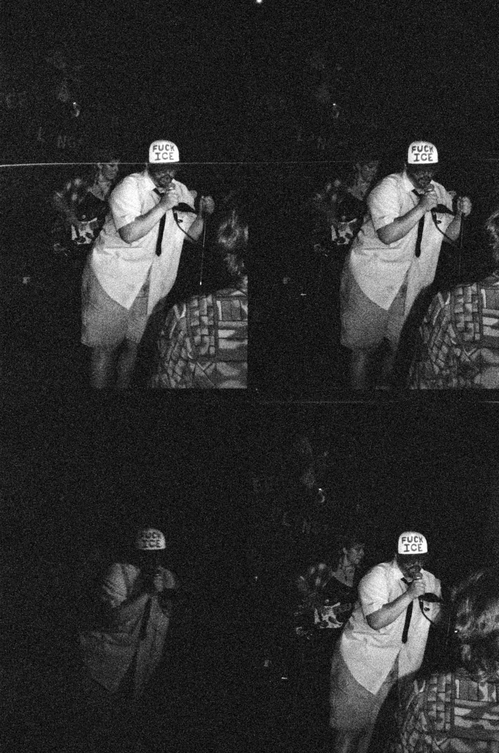 Black and white film photo collage of a performer on stage wearing a white cap and shirt, holding a microphone.