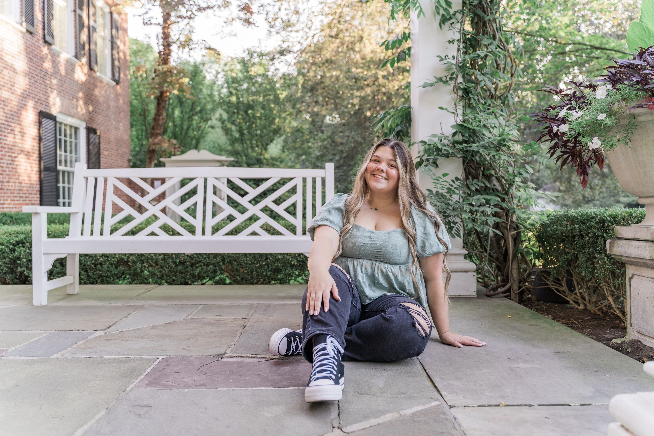 A series of connected images showing a person sitting on outdoor furniture and moving through a suburban garden path.