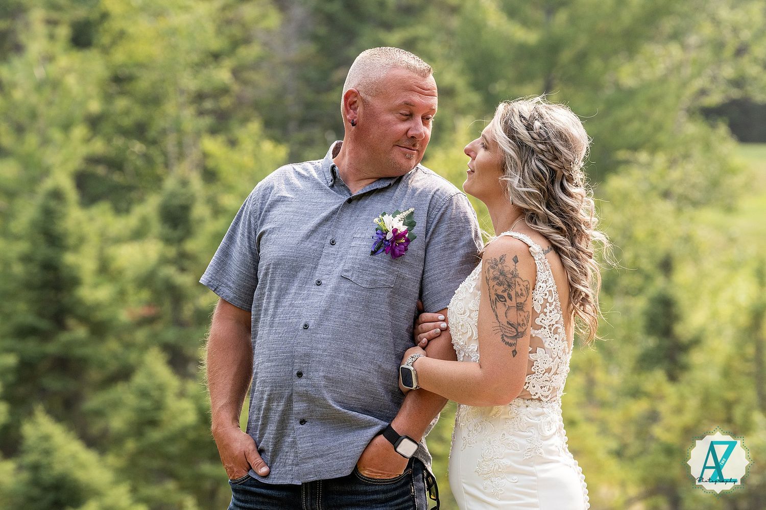 A couple in wedding attire share romantic moments in a lush outdoor garden setting while celebrating their special day.
