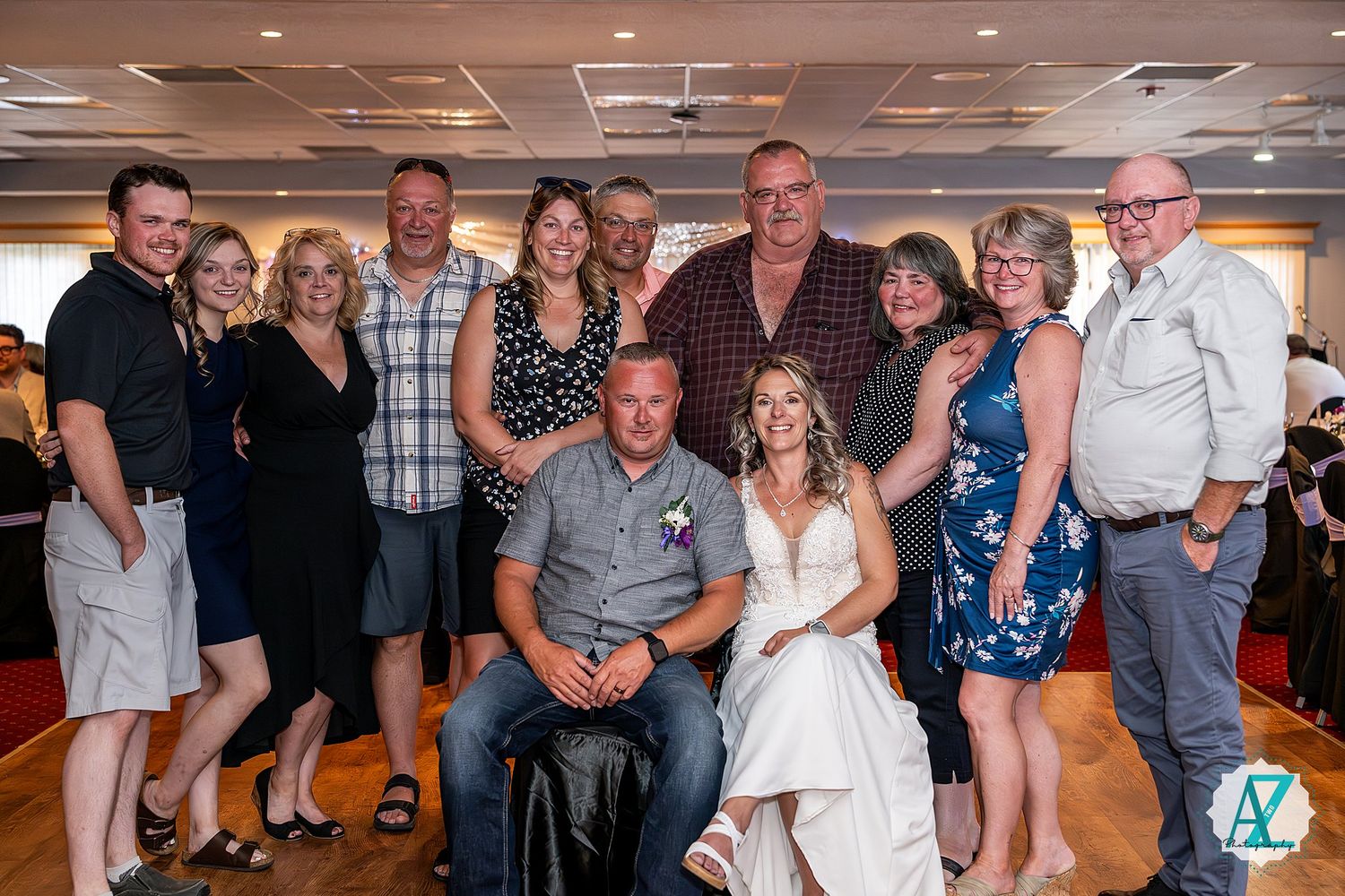 Group of people gathered at an indoor event with several photos showing them posing and socializing together during a celebration.
