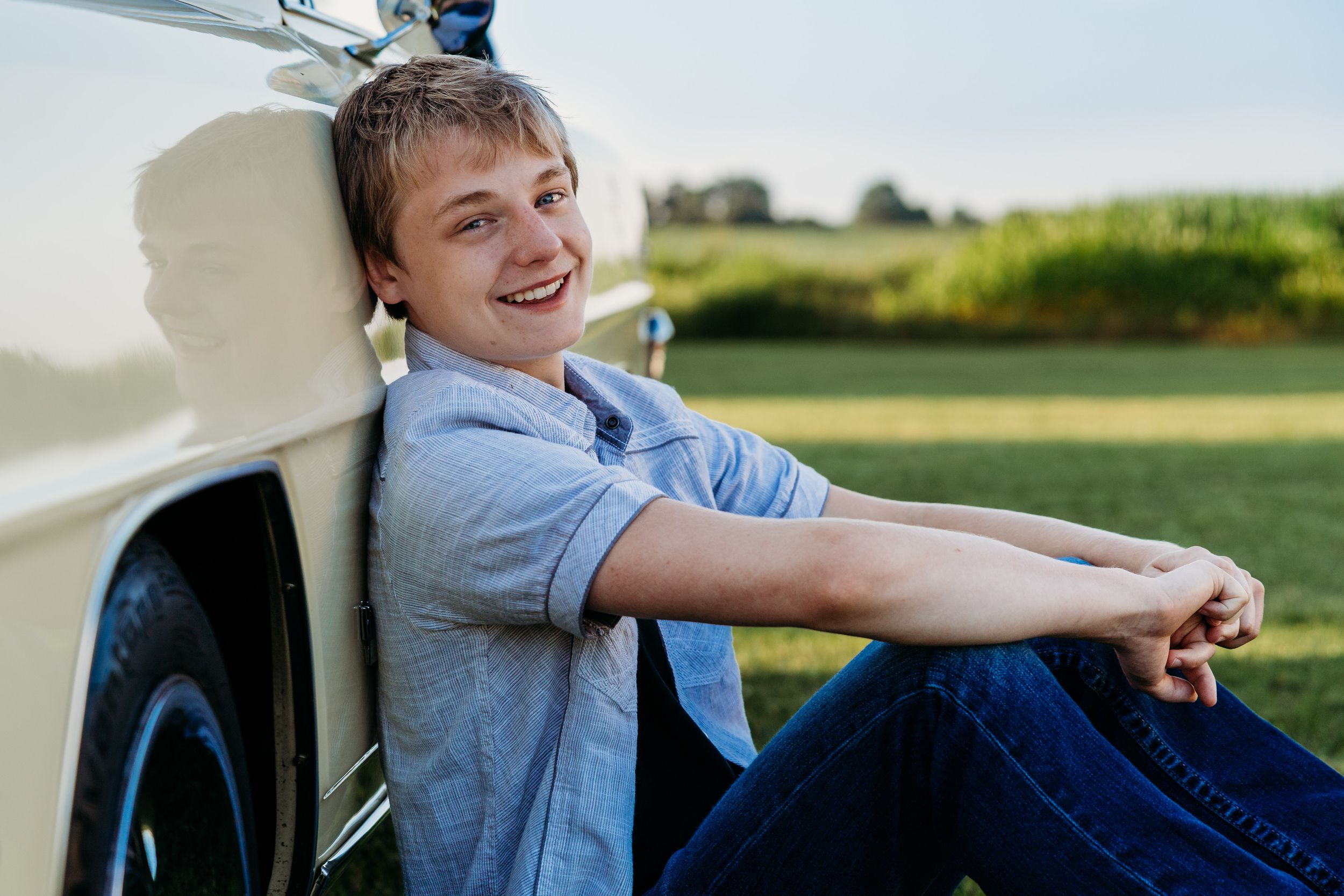 A series of connected images showing someone wearing a light blue shirt enjoying the sunny outdoors.