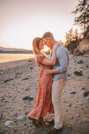 Couple snuggling each other during their beach photoshoot on Island County Whidbey Island Washington
