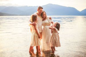 Family hugging with each other during their beach photoshoot on Island County Whidbey Island Washington