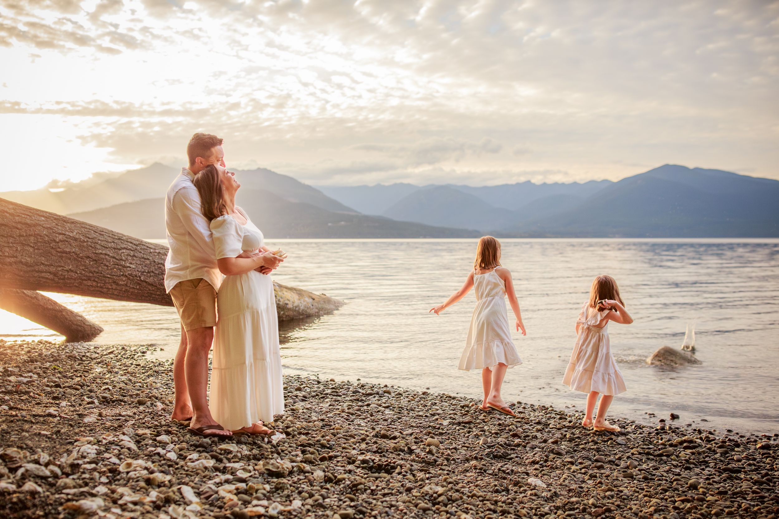 Family hugging with each other during their beach photoshoot on Island County Whidbey Island Washington