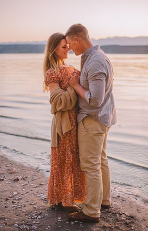 Couple snuggling each other during their beach photoshoot on Island County Whidbey Island Washington