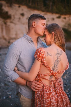 Engagement couple kissing together during their couples adventure photo session in Whidbey Island near Seattle Washington