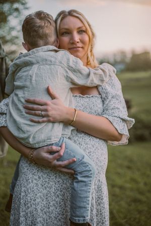 Family standing together during their family and maternity photoshoot at Whidbey Island near Seattle, Washington