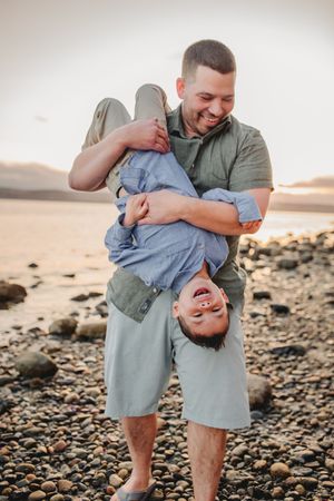 Dad and child together during their family photo session in Deception Pass near Seattle Washington