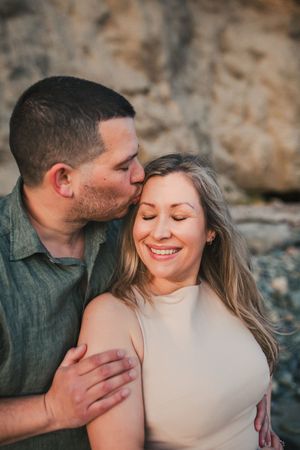 Couple kissing together during their family photo session in Whidbey Island near Seattle Washington