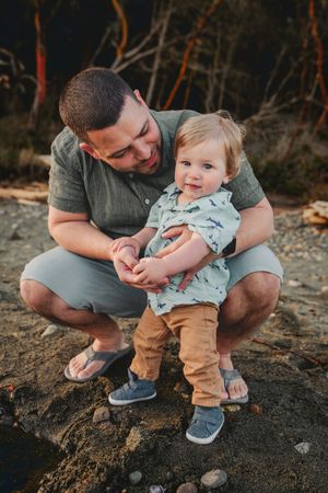 Dad and child together during their family photo session in Deception Pass near Seattle Washington