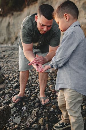 Dad and child togethertogether during their family photo session in Deception Pass near Seattle Washington
