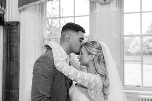 A romantic black and white photo collage showing tender moments between a couple in a bright interior setting.