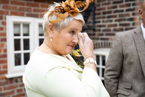A collection of candid emotional wedding moments captured against a brick wall backdrop.