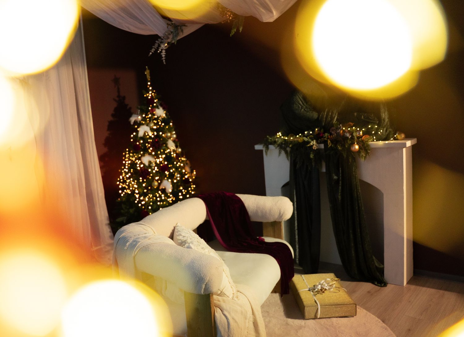 Glowing yellow orb lights create a warm bokeh effect against a dark background with soft silhouettes.