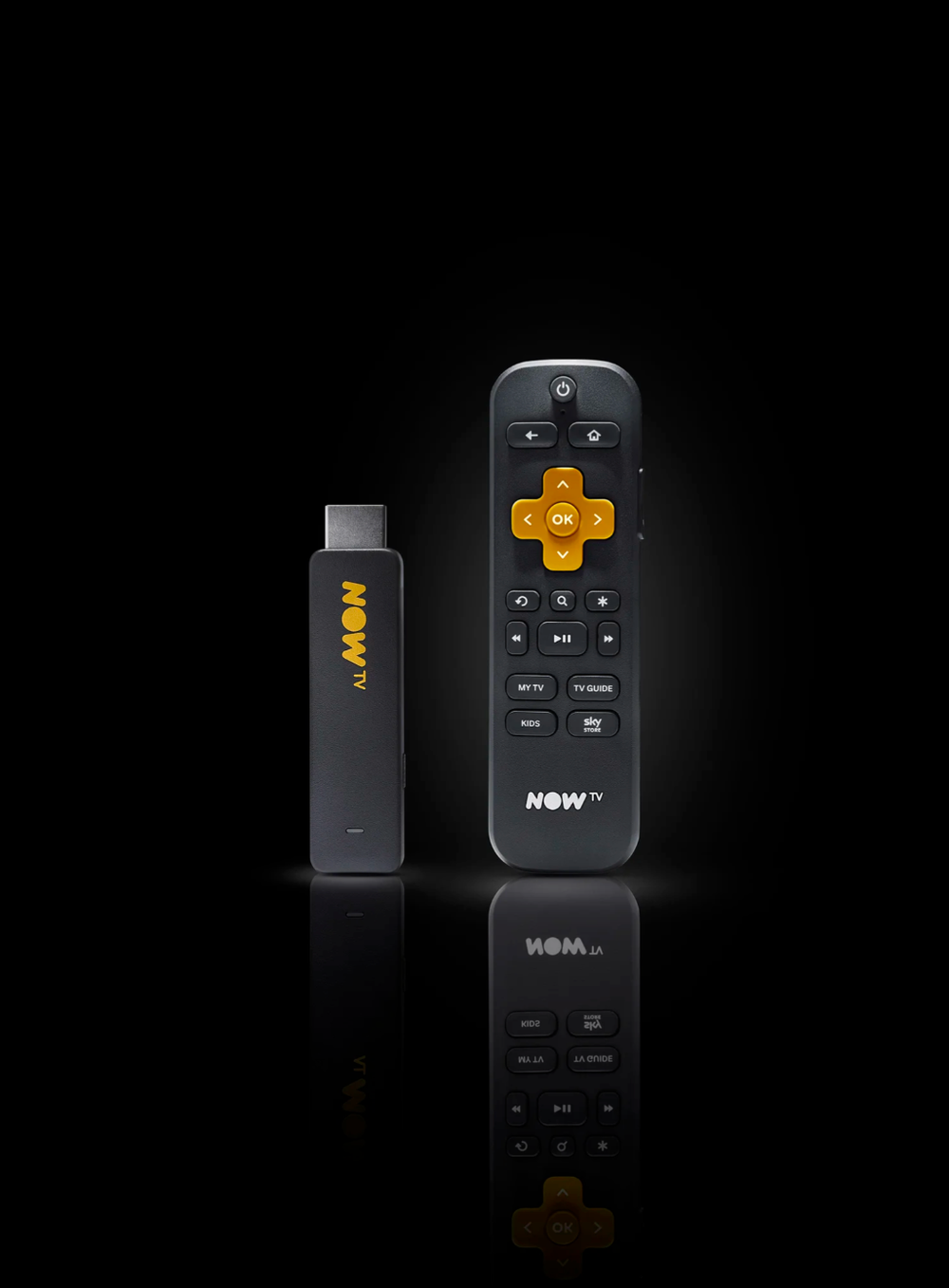 Black remote controls with orange accents displayed on reflective dark surface.