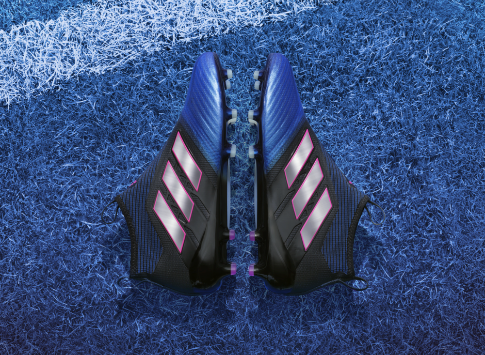 Close-up sequence showing black and purple Adidas soccer cleats on grass from different angles.