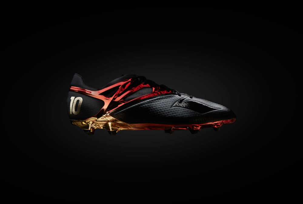 Stylish red and black soccer cleats shown in dramatic low-key lighting sequence.