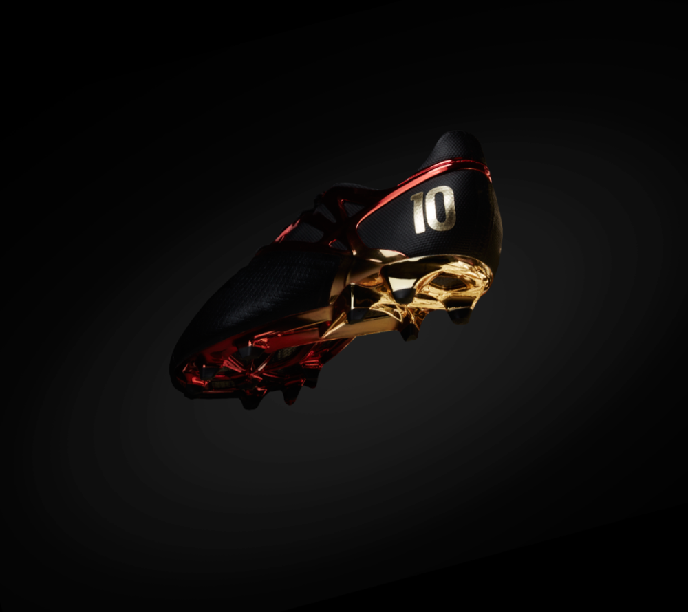 Soccer cleats with gold and red accents displayed in dramatic dark lighting series.