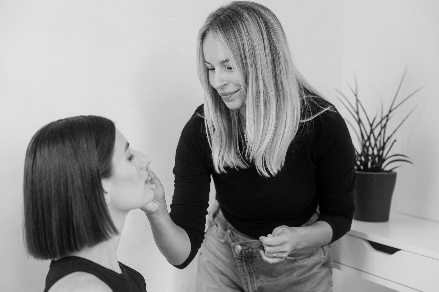 Series showing a hair styling consultation in black and white.