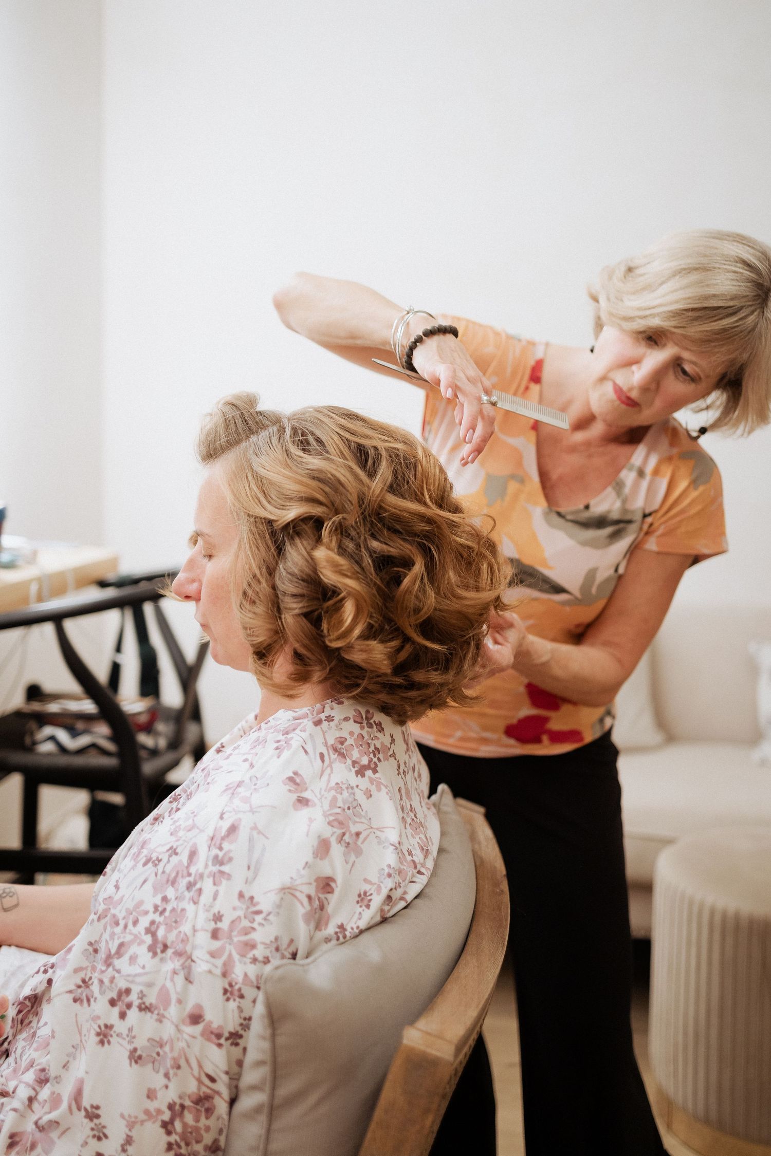 bridesmaid has her hair done at Cidery at 51 Acres bridal suite, luxury wedding photography Moncton New Brunswick photographer fine art