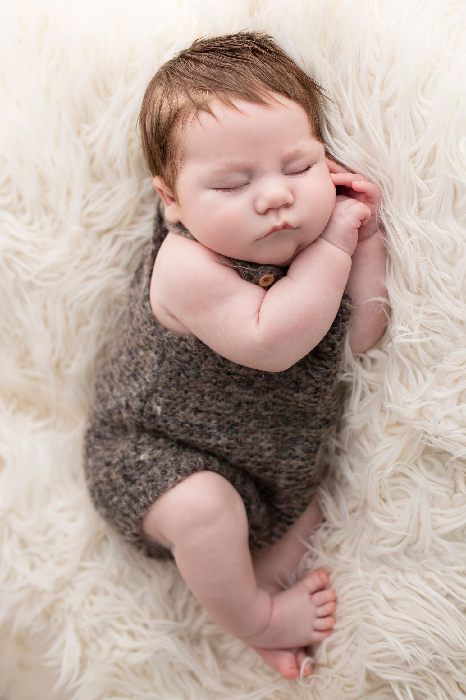 newborn baby sleeping on side by Little Wonderland Photography Widnes Cheshire