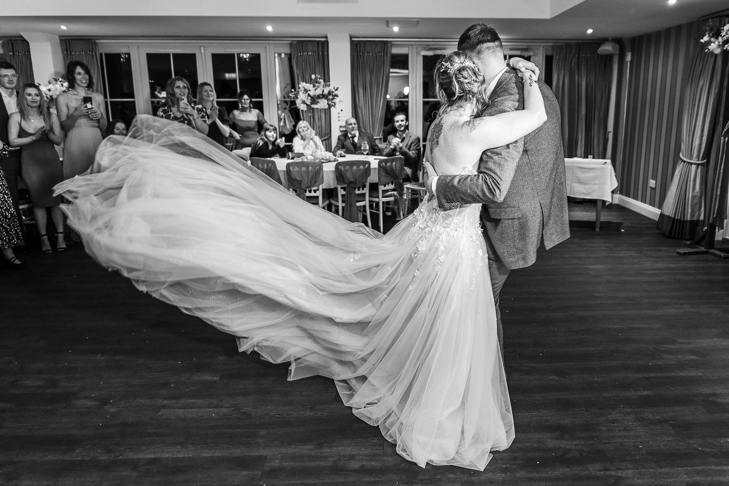 Couple’s first dance in the Kelham House Garden Room surrounded by guests