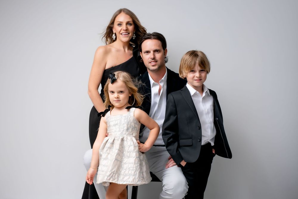 Luxury family photoshoot in studio with professional styling, makeup, and wardrobe.