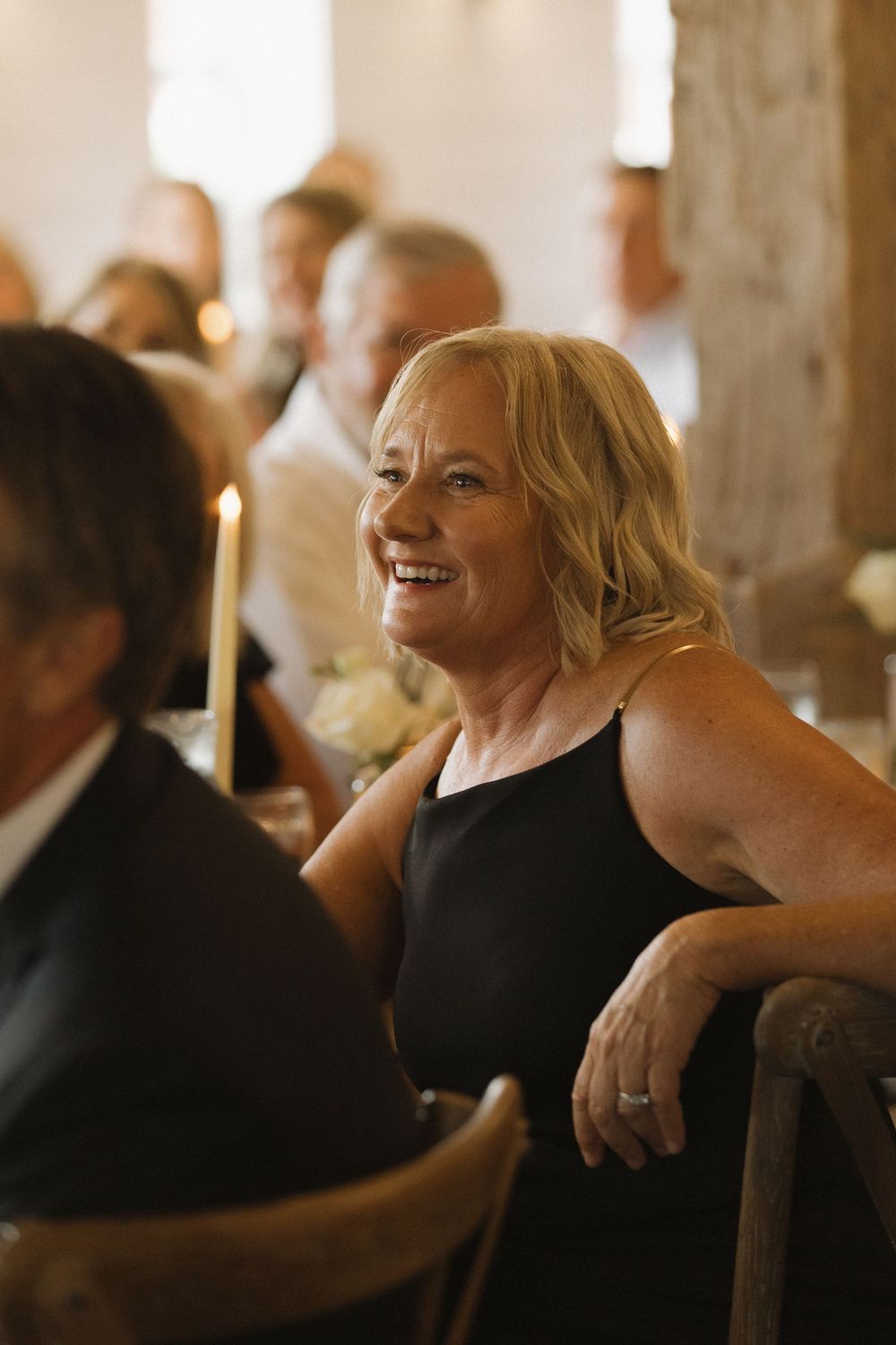 Guests share joyful moments during an elegant wedding reception.